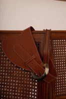 Brown leather belt by Adriana Castro named La Jefa, featuring a sleek design and high-quality craftsmanship.