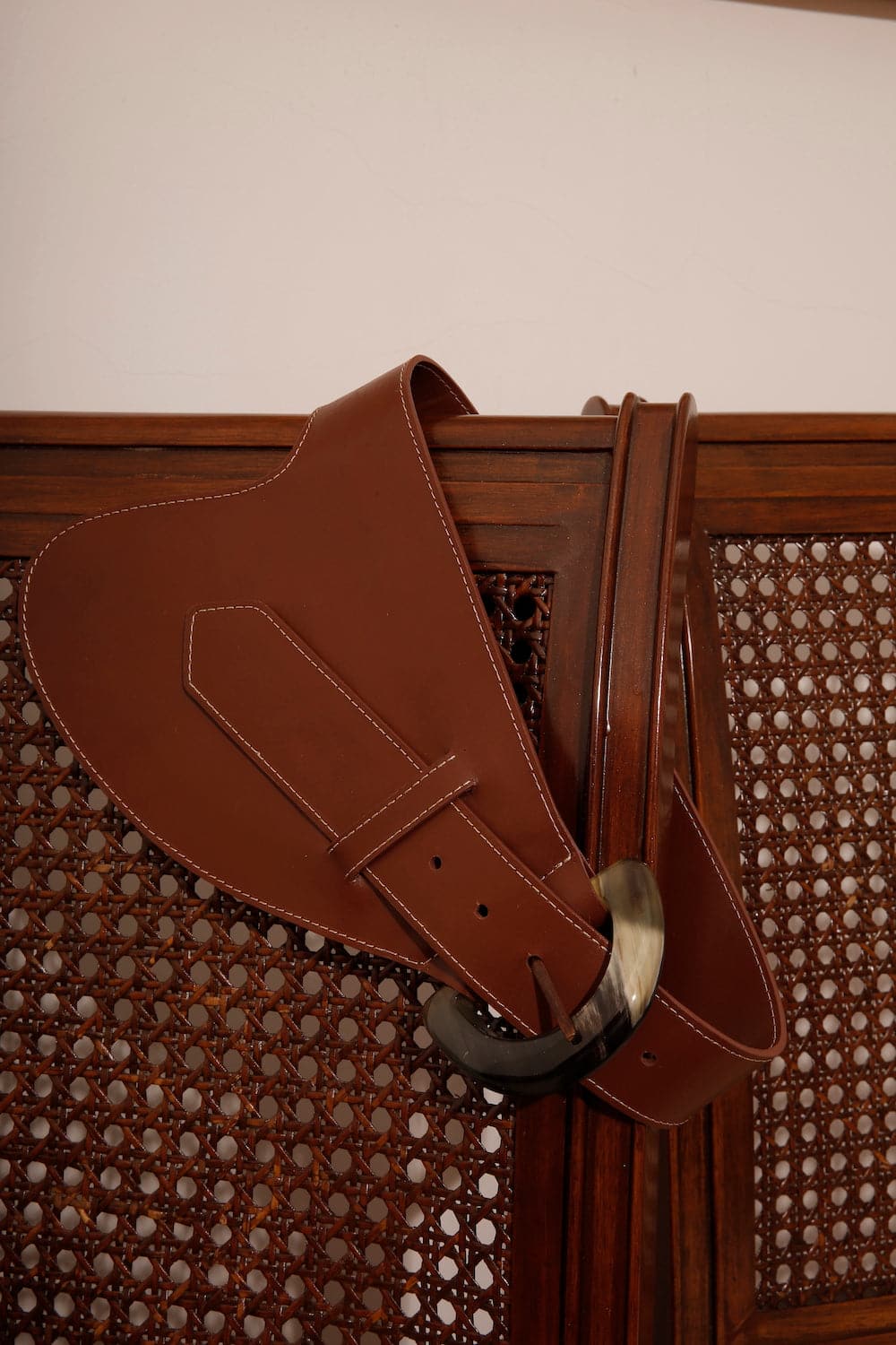 Brown leather belt by Adriana Castro named La Jefa, featuring a sleek design and high-quality craftsmanship.