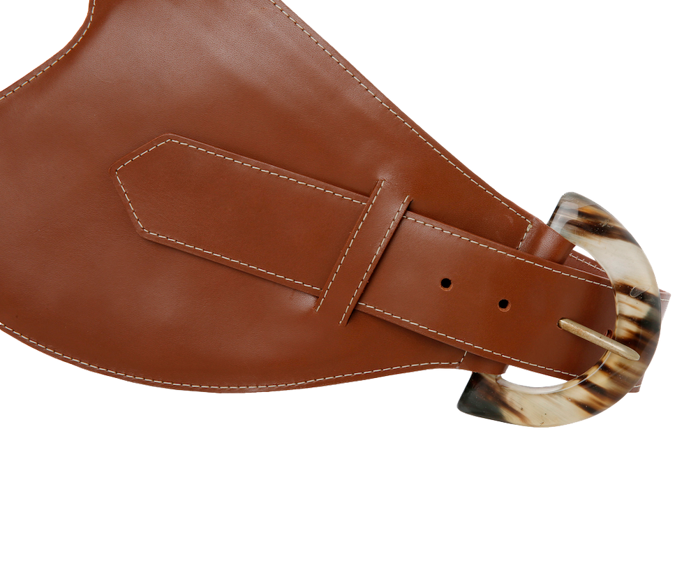 Brown leather belt by Adriana Castro featuring a sleek design and metal buckle, perfect for stylish waist accessories.