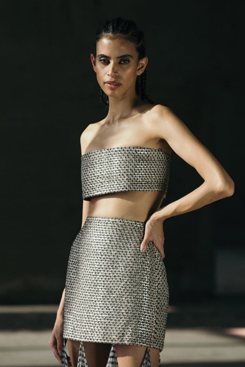 Hand-woven silk blend maxi skirt with chiffon panels in ecru, gray, and peach from AKHL, shown with flowing fabric details.