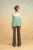Gray and turquoise silk blouse with fringe detailing and gradient design, by AKHL, shown in a close-up view.