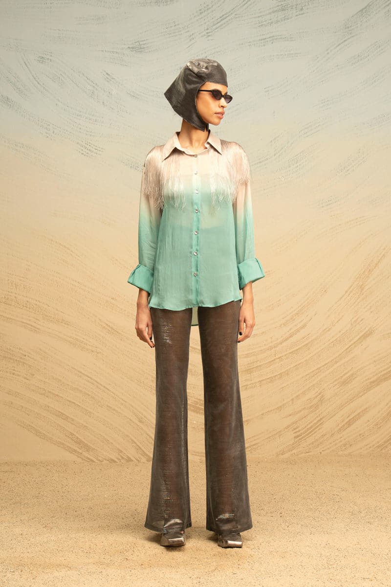 Gray and turquoise silk blouse with fringe detailing and gradient design, by AKHL, shown in a close-up view.