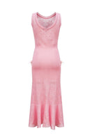 Pink feather-trimmed knit midi dress by Andreeva, shown in a stylish, fitted design with feather accents.