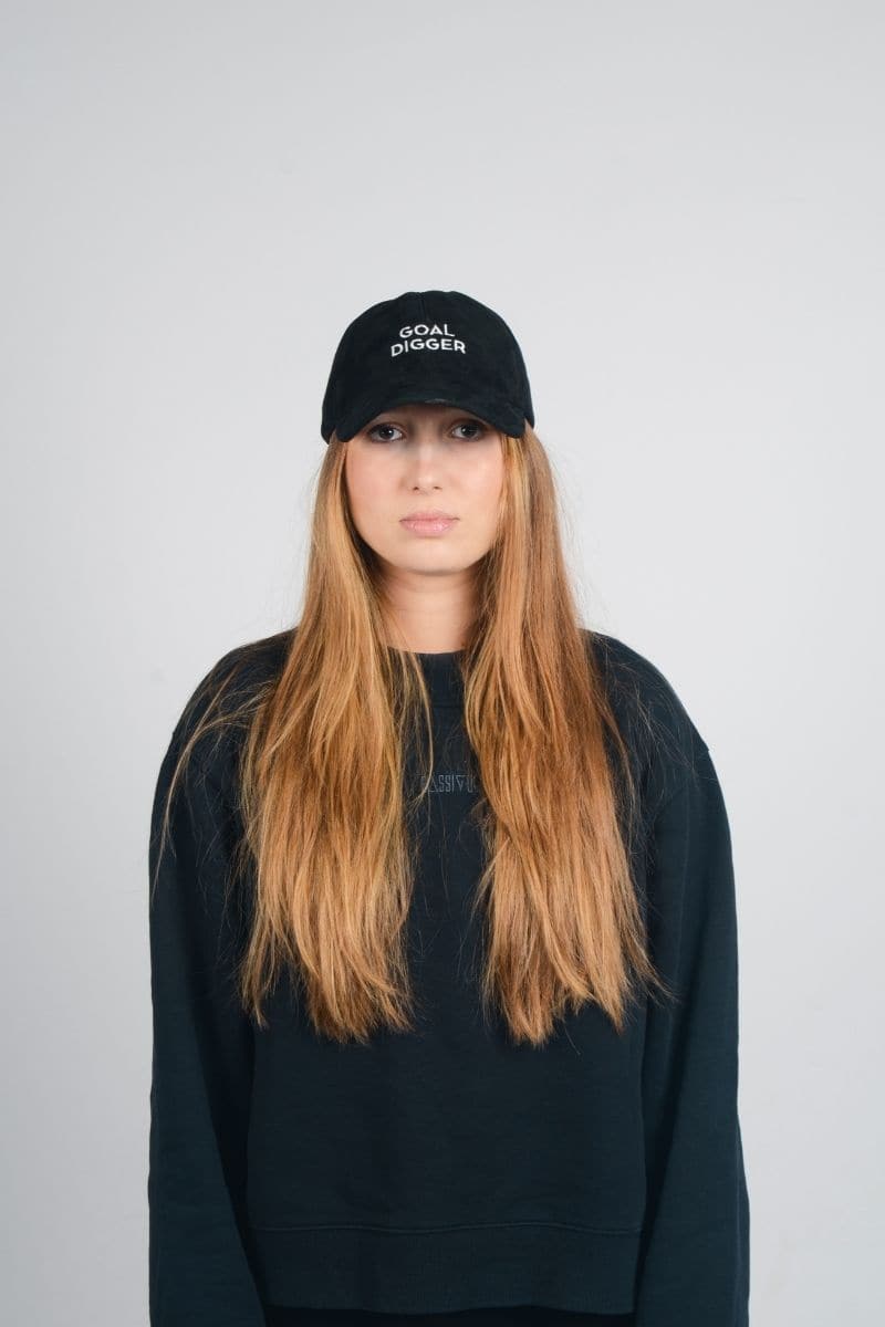 Black upcycled Goal Digger hat by Bassigue, stylish unisex hat made from sustainable materials, one size fits most.