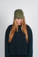 Brown upcycled hat from Bassigue's Respect Personal Space collection, showcasing eco-friendly design and comfortable fit.