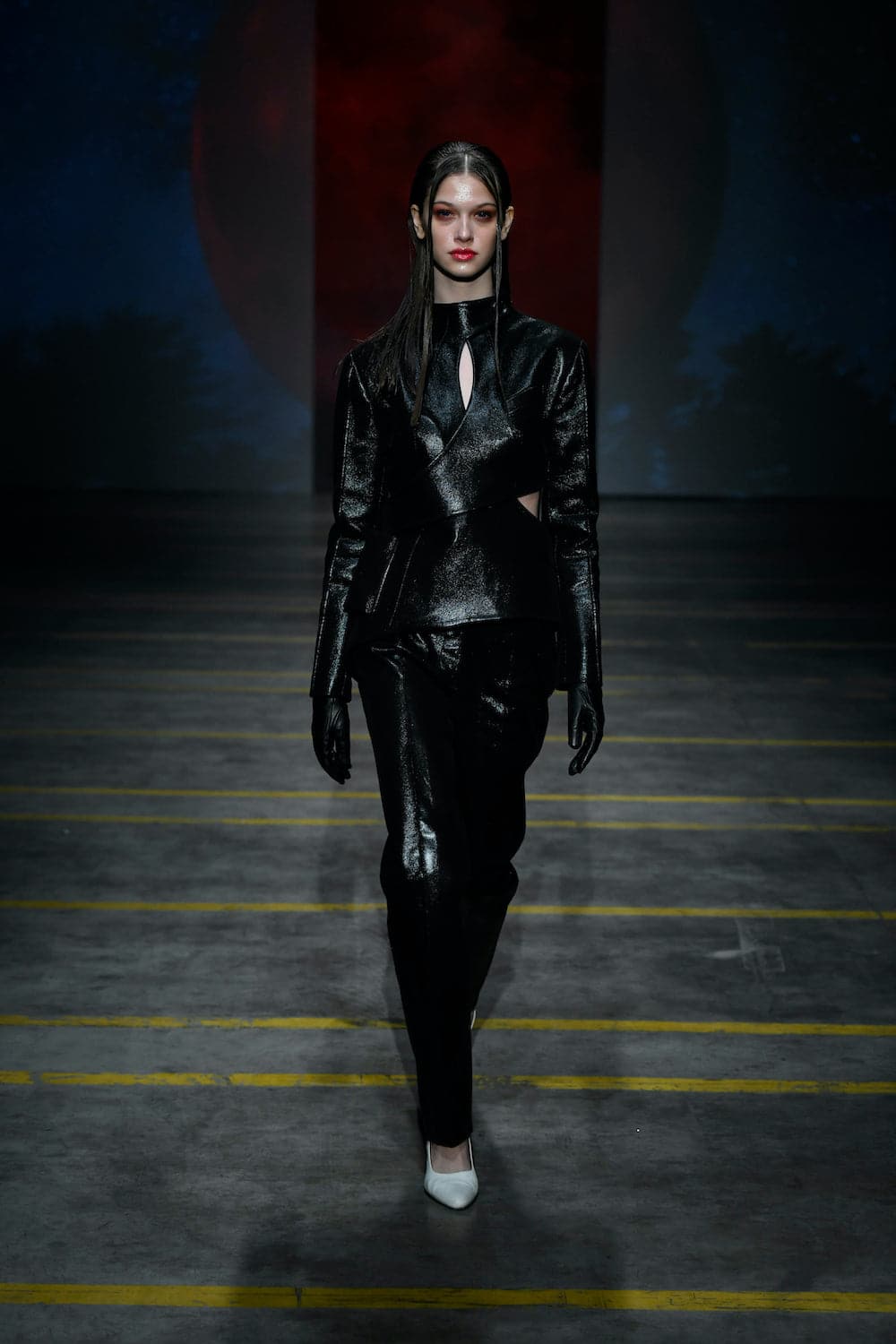 Asymmetric cutout vegan leather blazer by Blikvanger, featuring modern design and tailored fit in a lightweight black style.