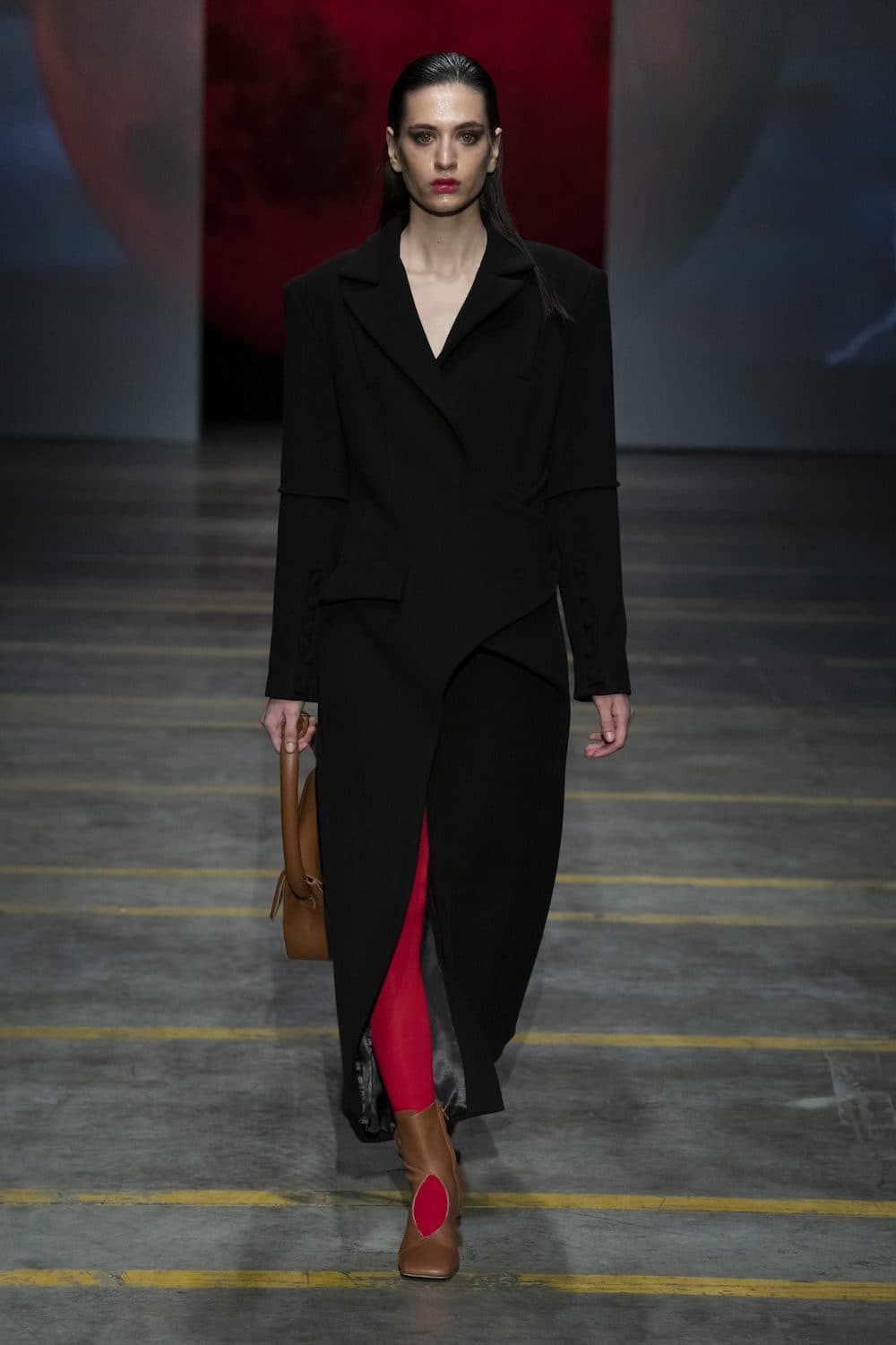 Blikvanger asymmetric wool-blend coat in neutral tones, featuring a stylish irregular hem and tailored fit.