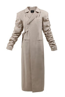 Beige crumple-sleeve trench coat by Blikvanger, showing textured fabric and stylish long sleeves.