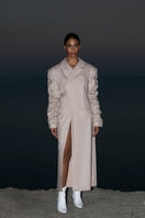 Beige crumple-sleeve trench coat by Blikvanger, shown in XS size with textured, crumpled fabric and classic trench design.