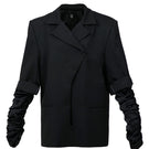 Black long blazer with crumple sleeves by Blikvanger, featuring a tailored fit and stylish design for a sophisticated look