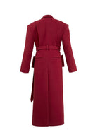 Full-length maroon coat by Blikvanger, structured design with tailored fit, displayed on a hanger against a neutral background.