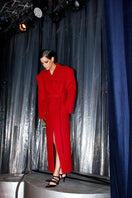Full-length maroon coat by Blikvanger, structured design, shown on a model, with tailored fit and classic collar detailing.
