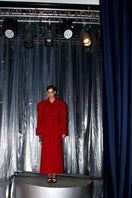 Full-length maroon coat by Blikvanger featuring a structured design and tailored fit, displayed on a white background.