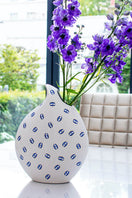 Casacarta eye teardrop ceramic vase for home decor, featuring a sleek, modern design with smooth ceramic finish.