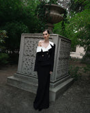 Black Dalood Aria straight maxi skirt made of lightweight fabric, shown on a model with a high waist and flowing design.