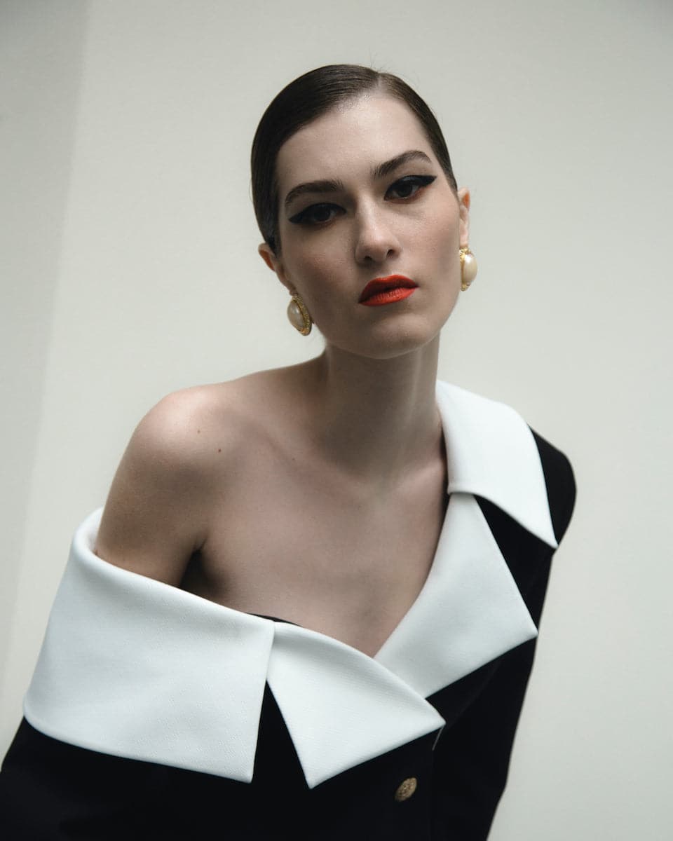 Black Dalood ARIA off-shoulder asymmetric blazer with a tailored fit and stylish design, displayed on a mannequin.