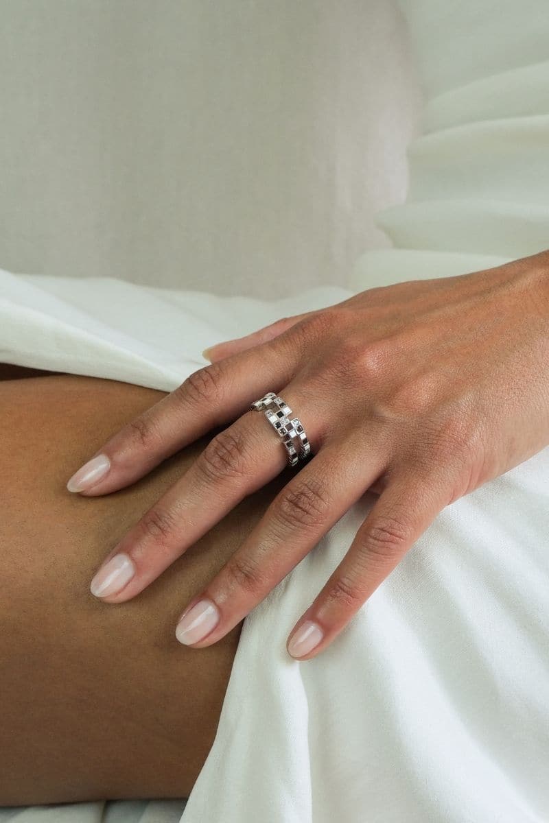 Silver EDXÚ Chichi Rhodium Ring featuring a sleek, polished design with a shiny rhodium finish.