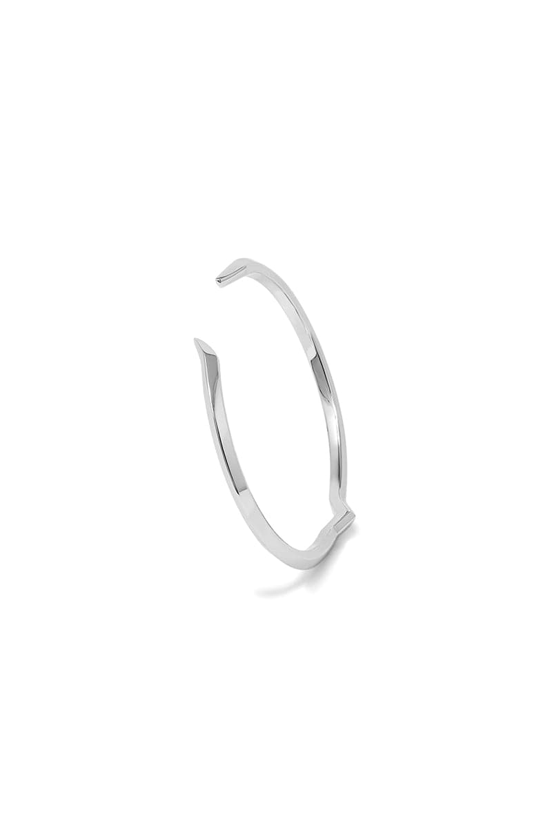 Rose gold EDXÚ FANG BANGLE bracelet with a sleek, modern design, featuring a smooth, polished surface and subtle detailing.