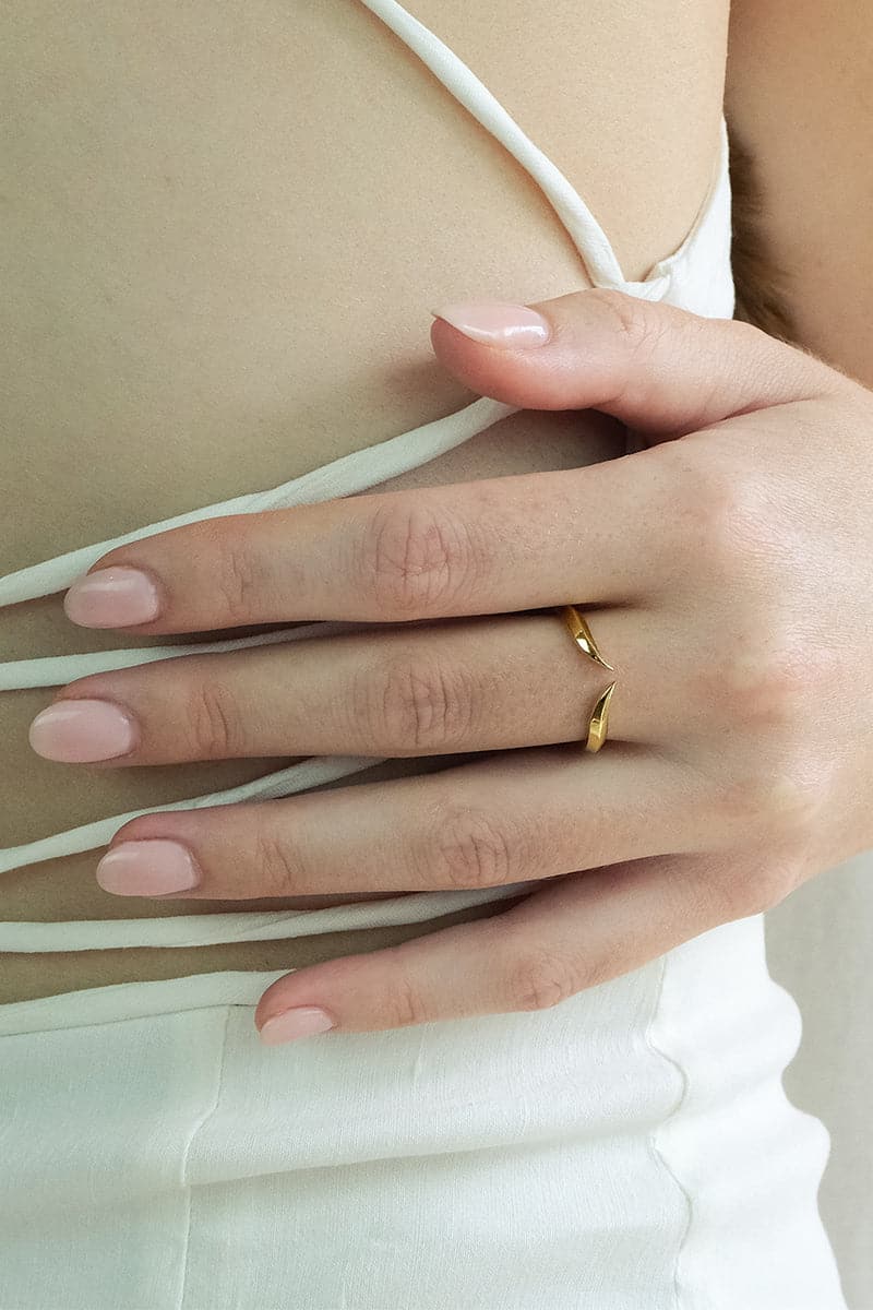 Yellow vermeil Fang Ring by EDXÚ, showcasing a sleek, modern design with a bold fang motif on a sterling silver band.