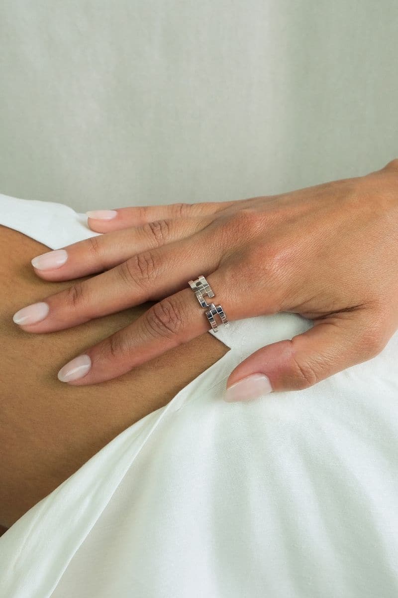 Elegant EDXÚ KIKI Rhodium Ring featuring a sleek, polished silver finish and a minimalist design.