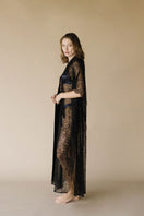 Black Kiharu satin long robe by Entos, shown in XS size, featuring smooth satin fabric and a relaxed fit for elegant loungewear.