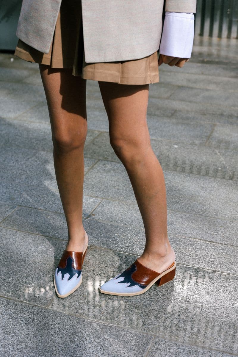 Gvasalia slingback leather cowboy shoes with heels in light blue and brown, featuring a stylish Western design and pointed toe.
