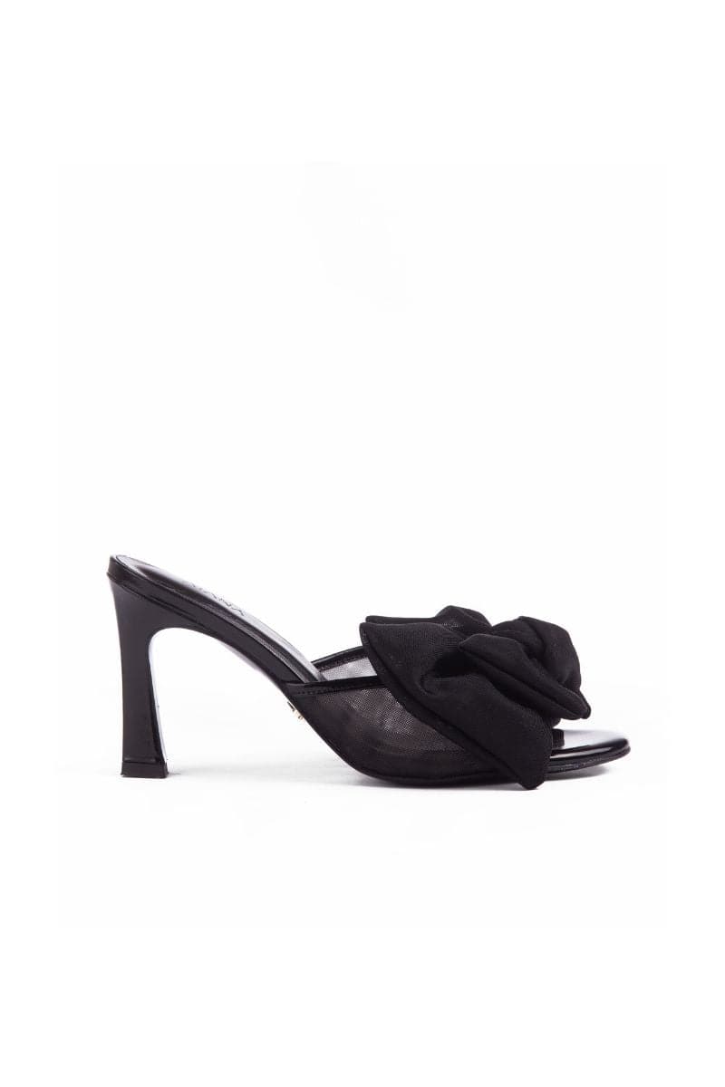 Black patent bow mules sandals by House of Atana with sleek design and pointed toe, perfect for stylish summer wear.