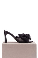 Black patent bow mules sandals by House of Atana with a sleek, shiny finish and stylish bow detail on the front.