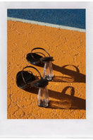 Black patent block heel sandals by House of Atana with transparent glass accents and open toe design.