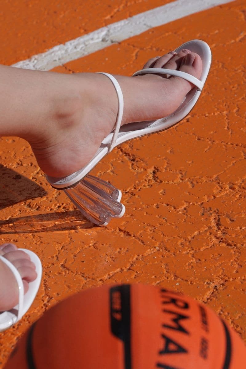 White patent block heel sandals by House of Atana featuring clear glass accents and a stylish design.