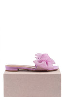 Violet bow sliders flats by House of Atana with adjustable straps and decorative bow detail on soft purple footwear.