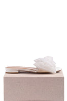 White patent bow slides flats by House of Atana, featuring a sleek design with a stylish bow detail and comfortable flat sole.
