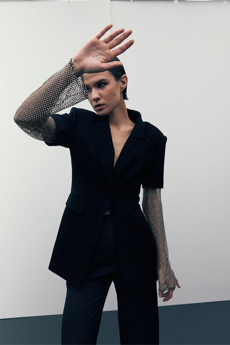 Black Diamond blazer by Joanna Andraos, tailored black blazer with a sleek fit, shown on a model.