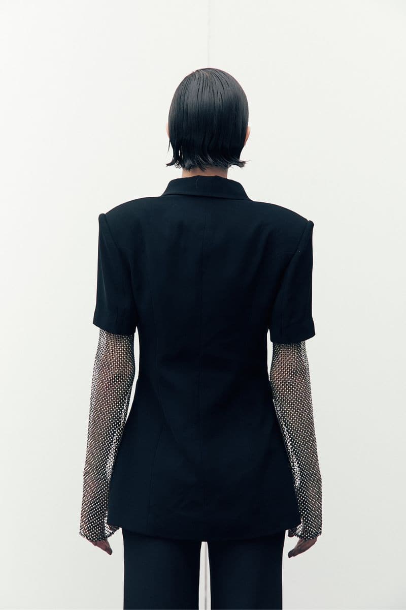 Black Diamond blazer by Joanna Andraos, tailored black blazer with structured fit, front buttons, and classic lapel.
