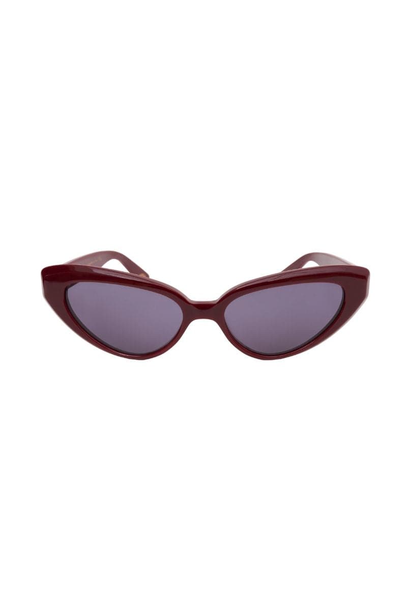 Ruby red Zawe cat-eye sunglasses by Kimeze with bold frames and stylish design, shown on a white background.