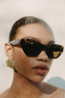 Kimeze Shell Concept 3 Cateye Sunglasses with stylish black frames and tinted lenses.