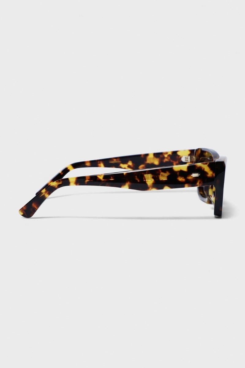 Kimeze Shell Concept 3 cat-eye sunglasses with black frames and tinted lenses showcasing stylish eyewear design