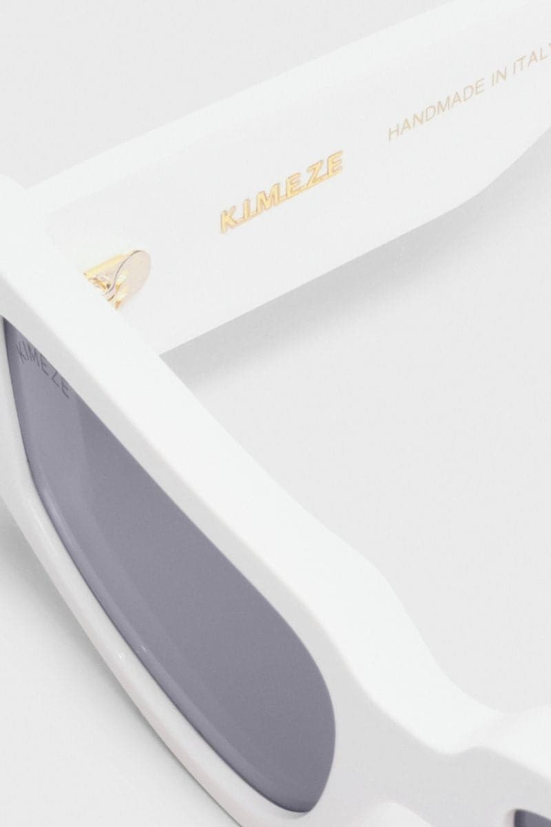 White Concept 2 square cateye sunglasses by Kimeze with bold frames and stylish design, shown on a plain background.