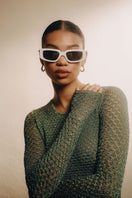 White Concept 2 square cateye sunglasses by Kimeze with sleek white frames and dark tinted lenses.