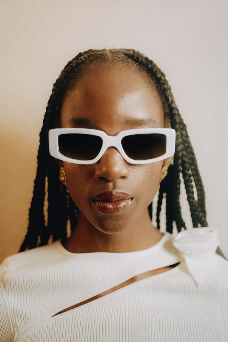 White Concept 2 square cateye sunglasses by Kimeze with bold white frames and dark tinted lenses.