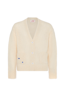 Cream knitted cardigan by La Granni, featuring a cozy, textured design, displayed on a hanger with a soft background.