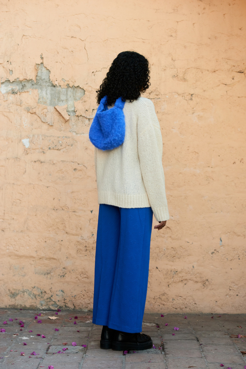 Cream knitted cardigan by La Granni, featuring a cozy, textured design and button closure, in size XS.