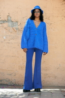 Light blue La Granni SURI knitted cardigan with a cozy fit, featuring button closure and ribbed cuffs and hem.