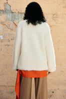 Cream knitted crewneck sweater from La Granni's SURI collection, featuring a cozy, textured knit fabric and classic fit.