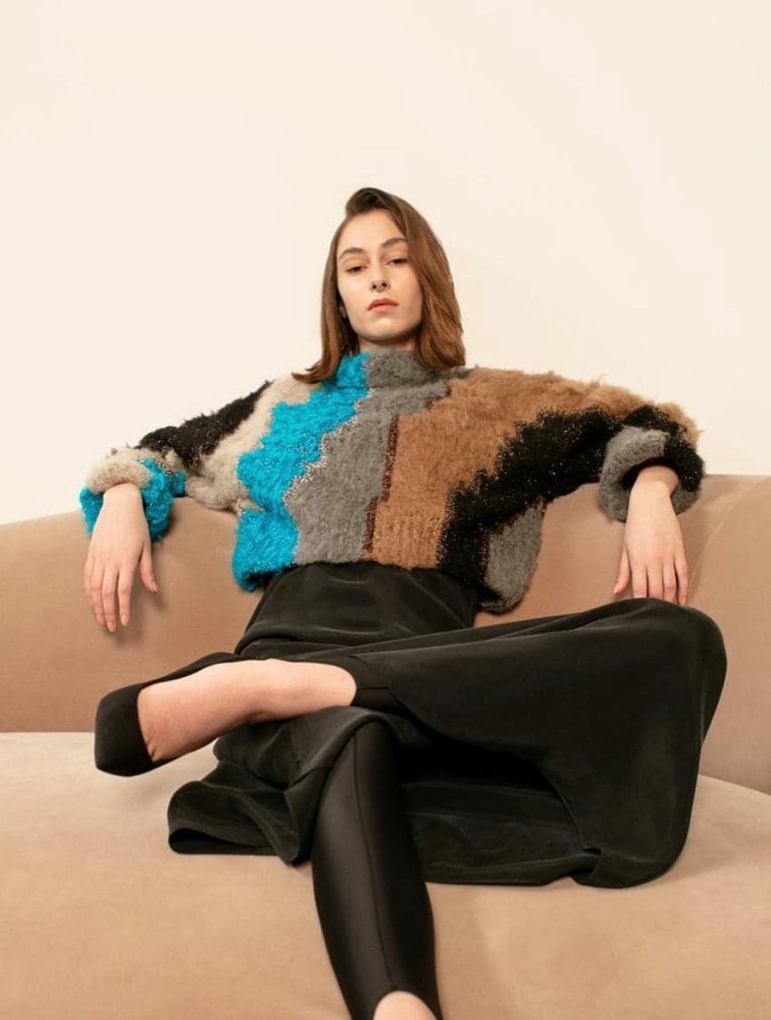 Lalo cropped wool sweater in soft knit fabric, featuring a fitted silhouette and ribbed cuffs, styled on a model.