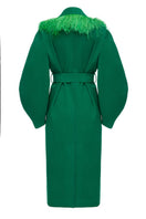 Green belted wool coat with feather detailing by Lalo, shown in a close-up view highlighting the fabric and belt design.