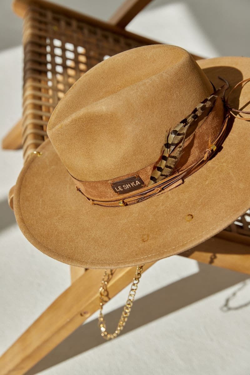 Beige fire felt hat by LE SH KA featuring a classic wide brim and stylish design for fashionable headwear.