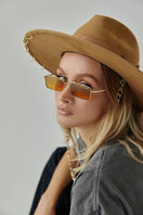 Beige fire felt hat by LE SH KA featuring a classic wide brim and stylish design, perfect for fashionable outdoor wear.
