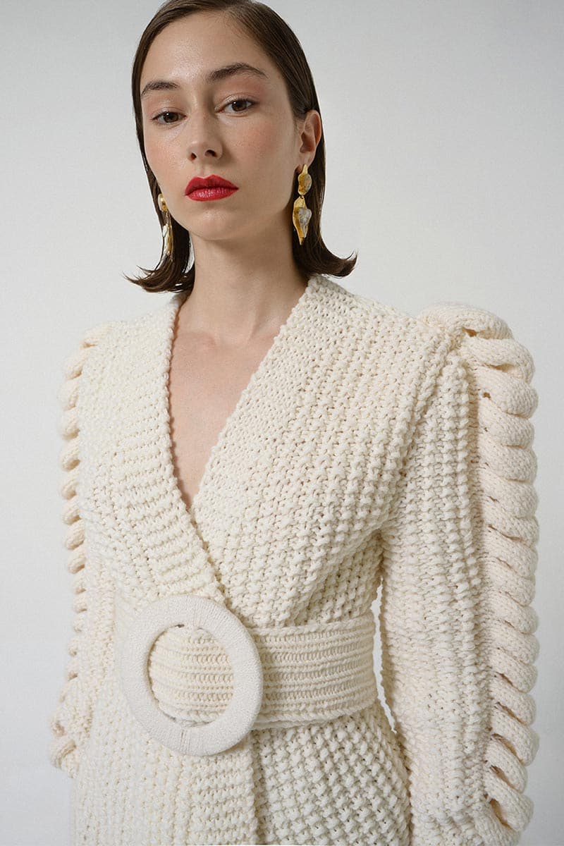 Liya belted cardigan with knit sleeves in white, featuring a waist belt and cozy knit detailing, stylish and comfortable for everyday wear.