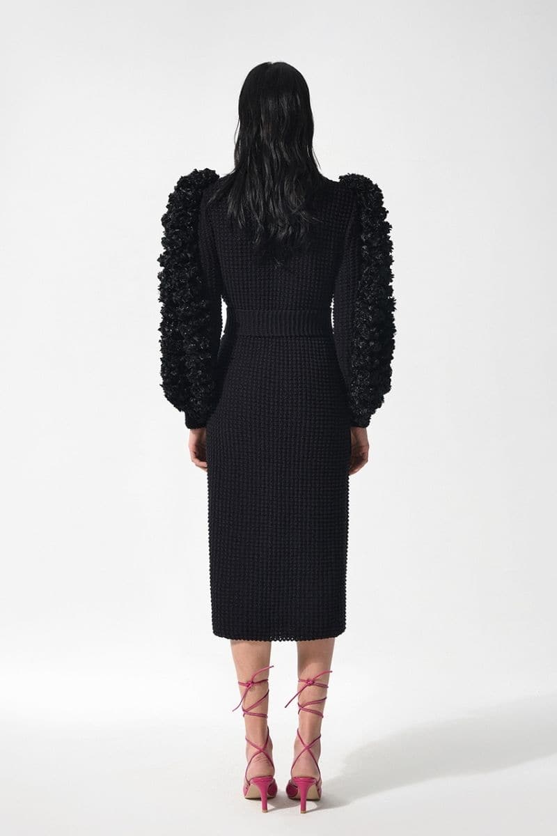 Black Liya statement sleeves cardigan featuring bold, ruffled sleeves and a cozy fit, perfect for stylish layered looks.